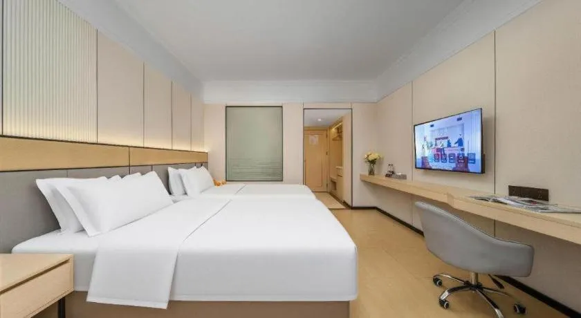 Bed in Vienna Hotel Nanning Train Station