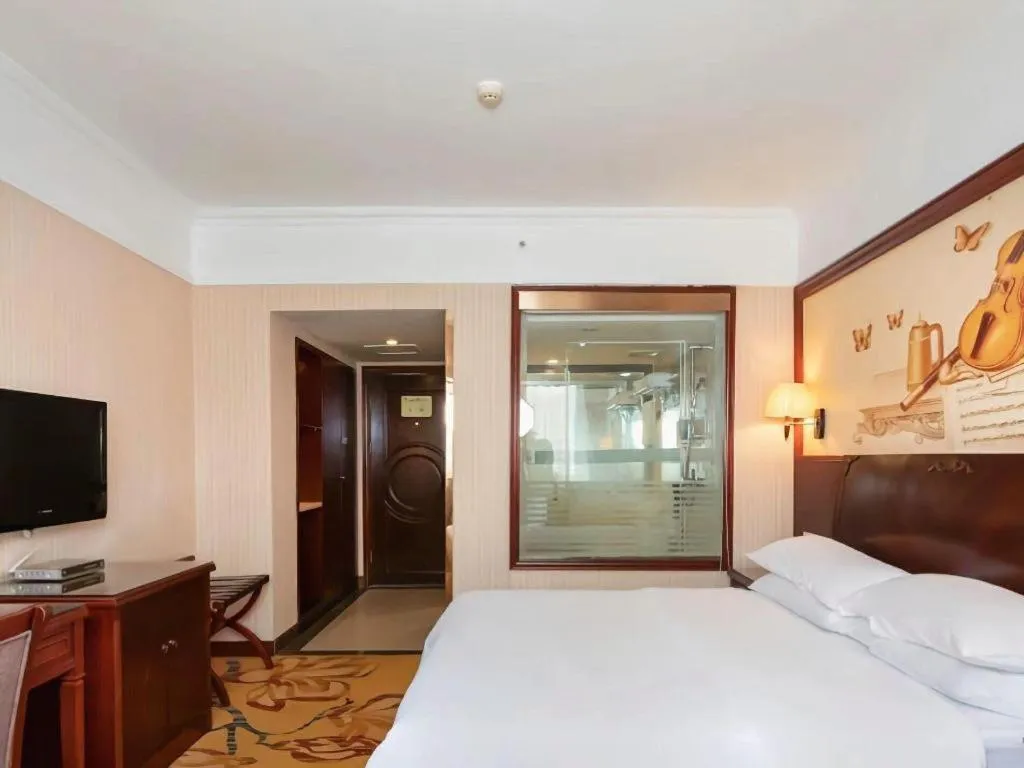 Bed in Vienna Hotel Nanning Train Station