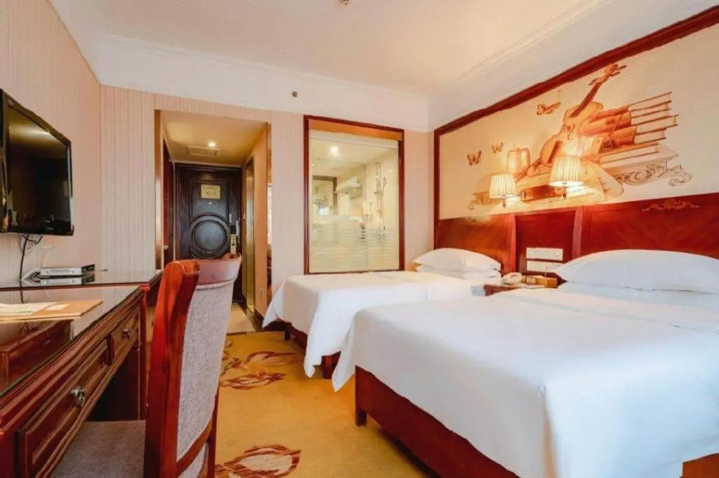 Bed in Vienna Hotel Nanning Train Station