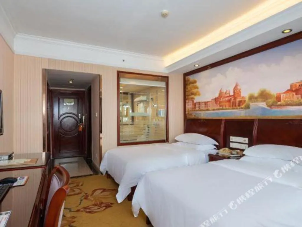 Bed in Vienna Hotel Nanning Train Station