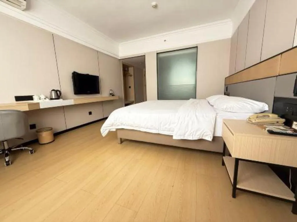 Bed in Vienna Hotel Nanning Train Station