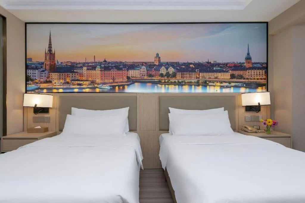 Bed in Vienna Hotel Nanning Train Station