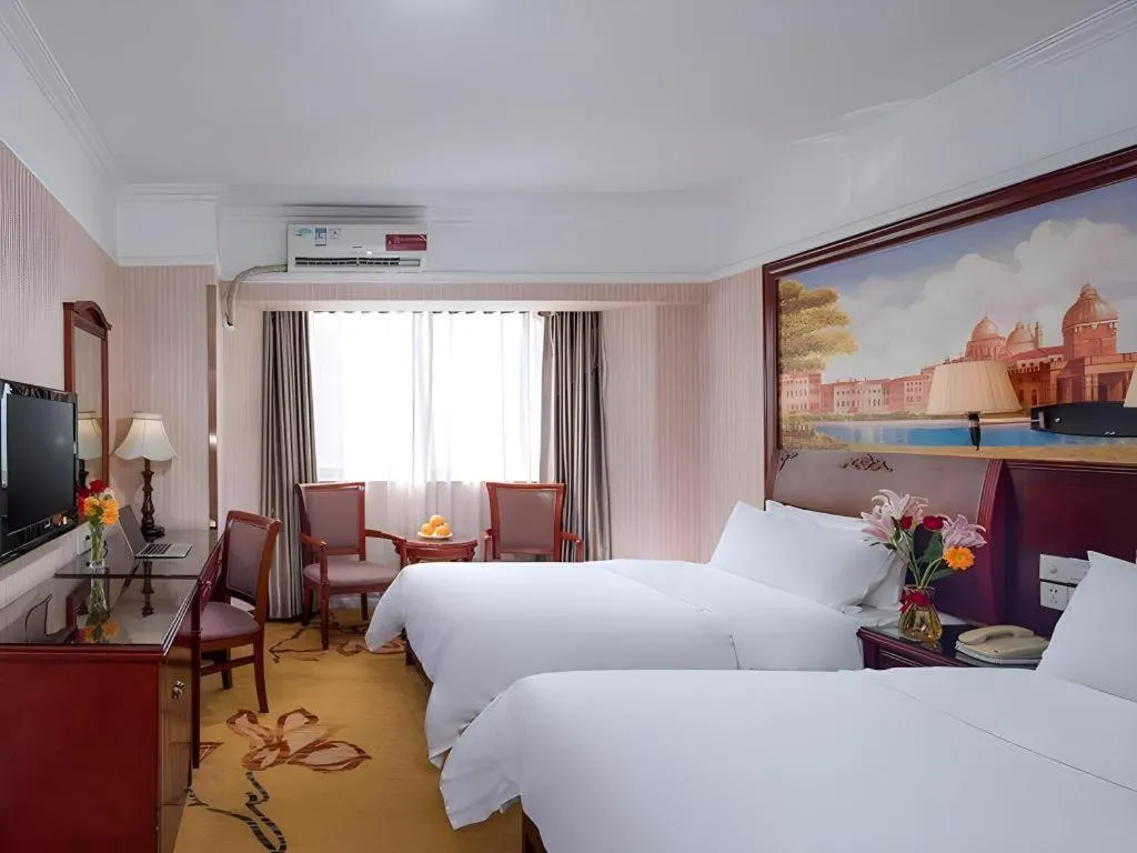 Bed in Vienna Hotel Nanning Train Station