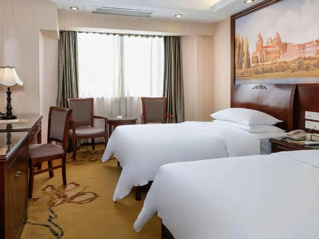 Bed in Vienna Hotel Nanning Train Station