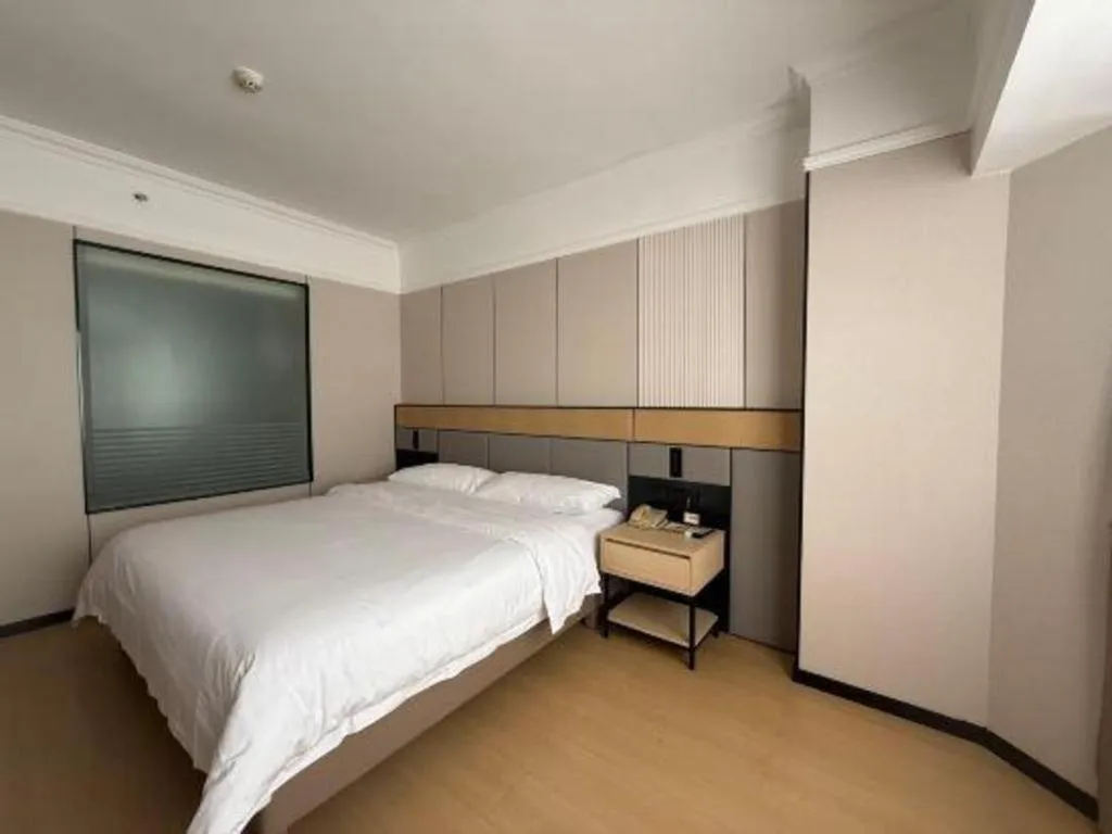 Bed in Vienna Hotel Nanning Train Station