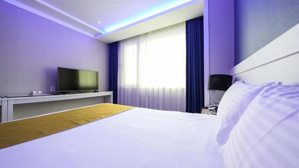 Bed in Galaxy Hotel