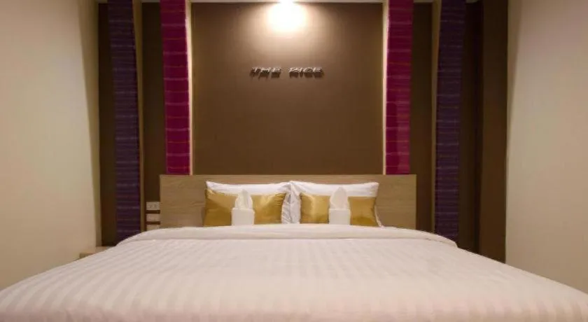 Bed in The Rice Hotel