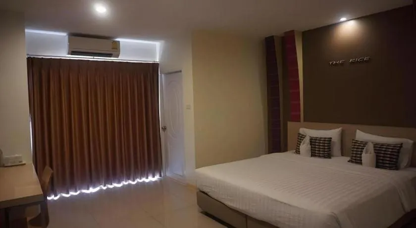 Bed in The Rice Hotel