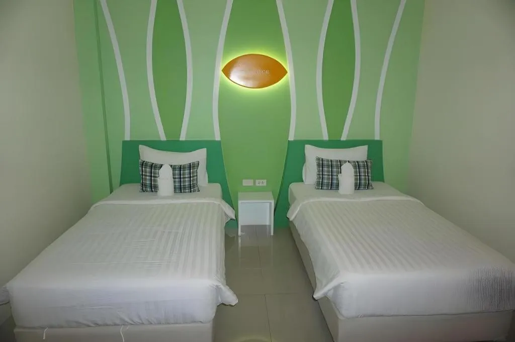 Bed in The Rice Hotel