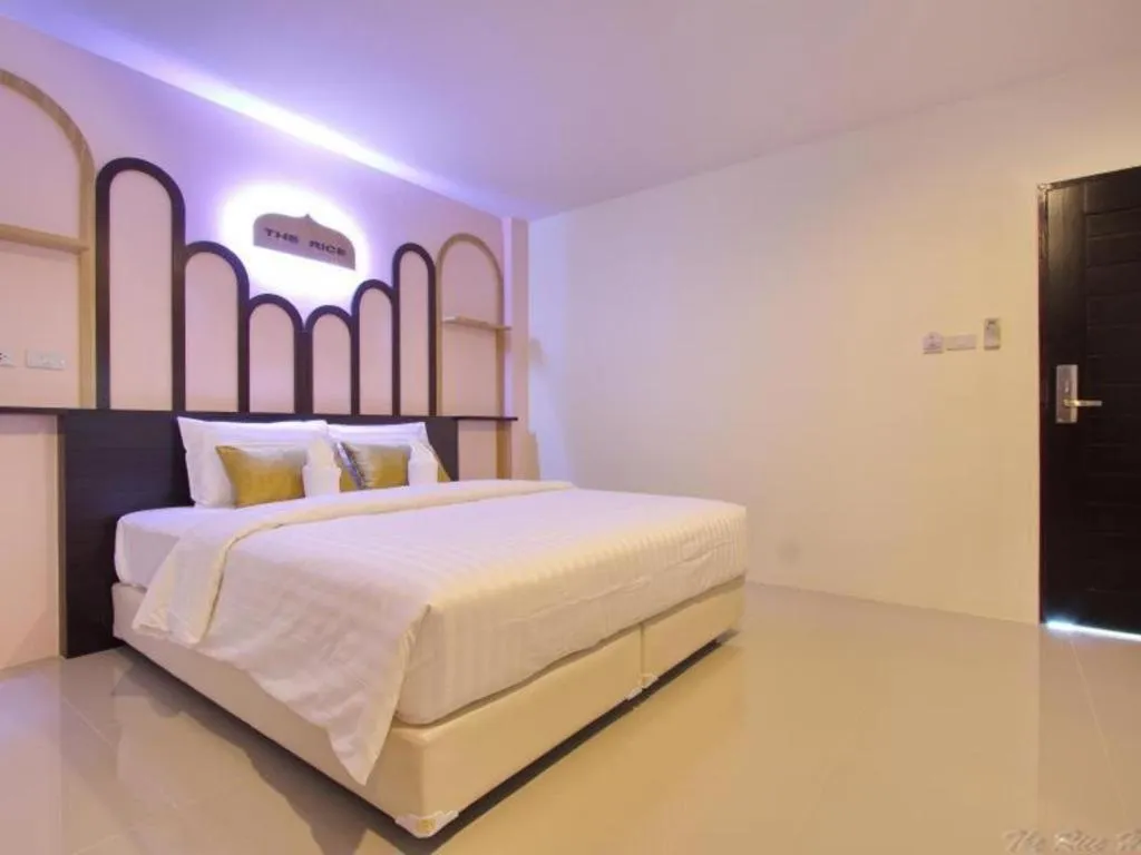 Bed in The Rice Hotel