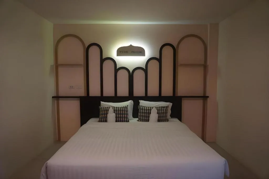 Bed in The Rice Hotel