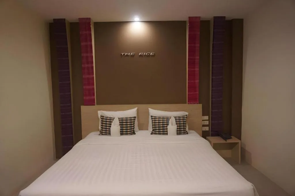 Bed in The Rice Hotel