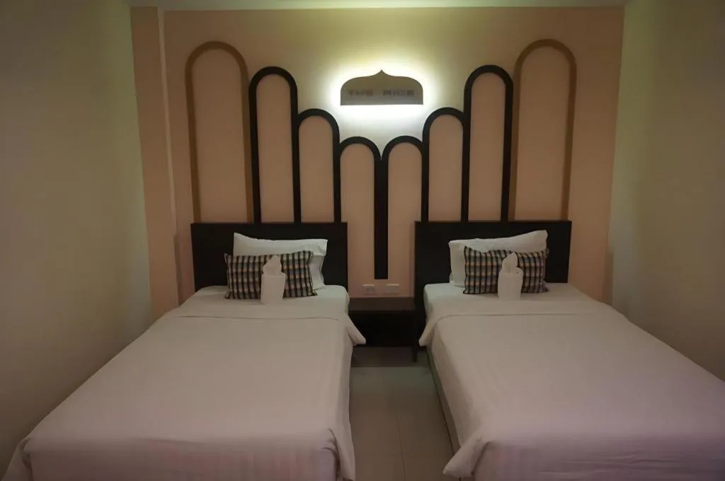 Bed in The Rice Hotel