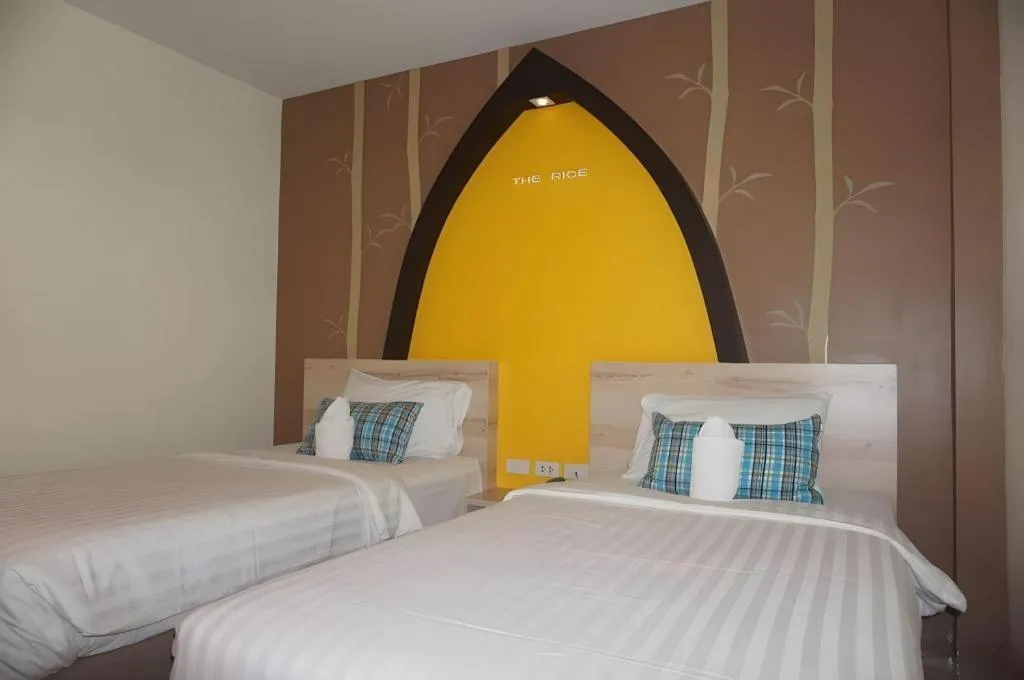 Bed in The Rice Hotel