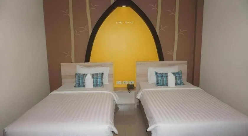 Bed in The Rice Hotel