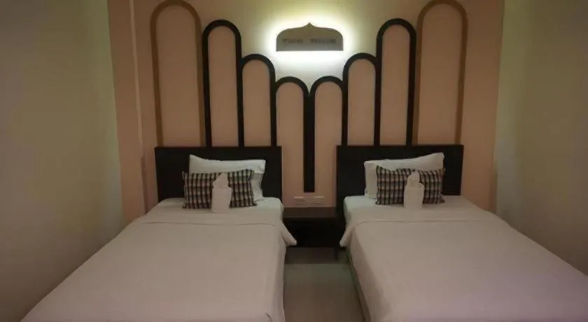 Bed in The Rice Hotel