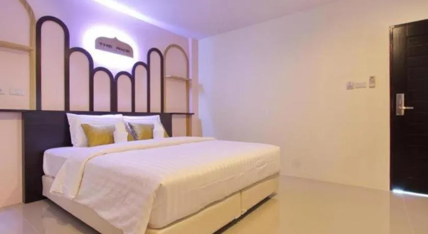 Bed in The Rice Hotel