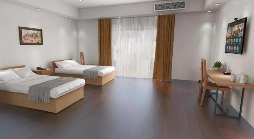 Bed in GreenTree Inn Changshu Zhaoshangcheng Express Hotel