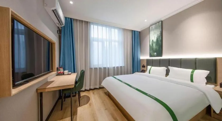 Bed in GreenTree Inn Zhejiang Ningbo Exhibition and Convention Center Bus East Station Express Hotel
