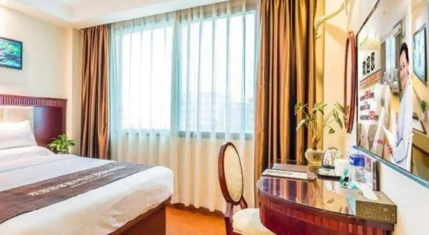 Bed in GreenTree Inn Guangzhou Baiyun International Airport Huaxi Road Express Hotel