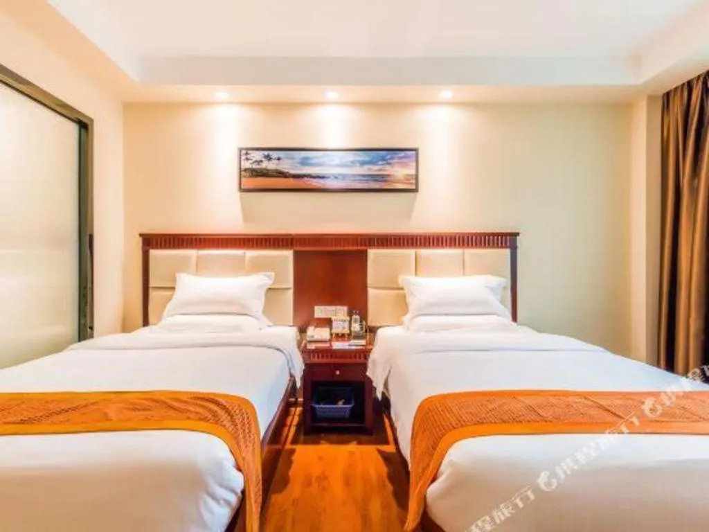 Bed in GreenTree Inn Guangzhou Baiyun International Airport Huaxi Road Express Hotel