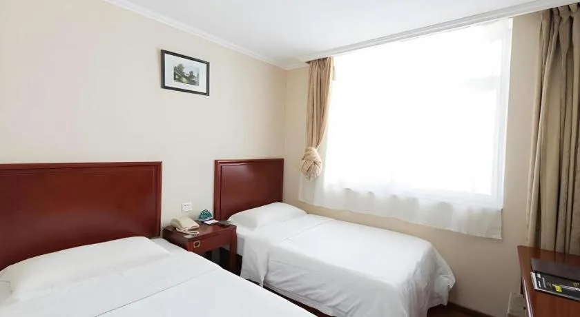 Bed in GreenTree Inn West Railway Station North Square Hotel