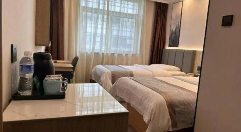 Bed in GreenTree Inn West Railway Station North Square Hotel