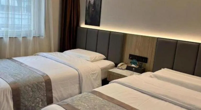 Bed in GreenTree Inn West Railway Station North Square Hotel