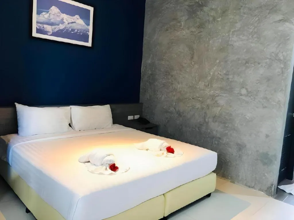 Bed in The Peak Boutique Hotel