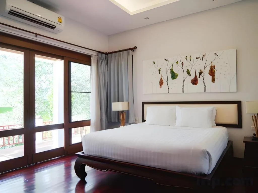 Bed in Doltara Boutique Resort