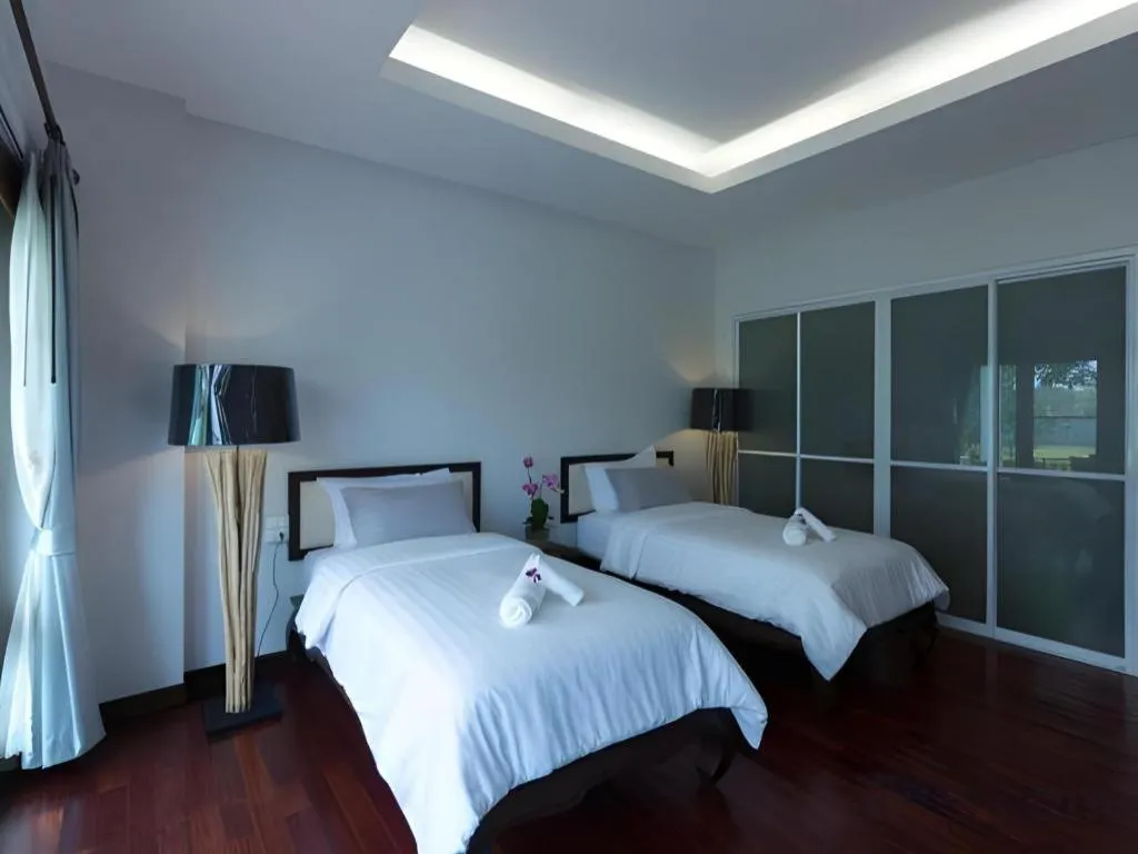 Bed in Doltara Boutique Resort