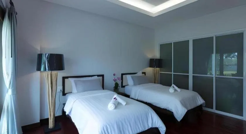 Bed in Doltara Boutique Resort