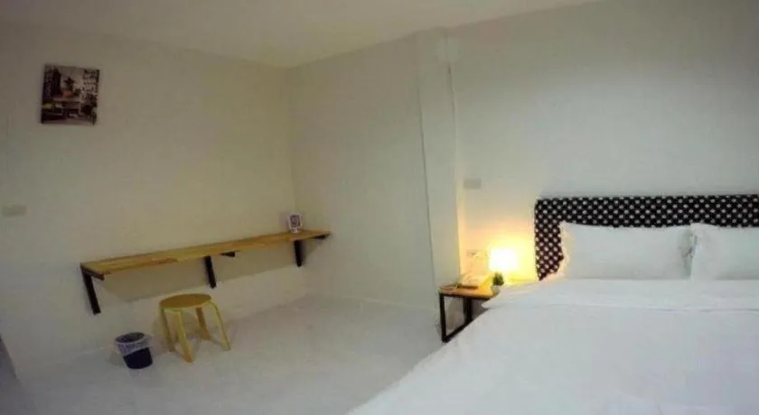 Bed in Maalamaii Hotel