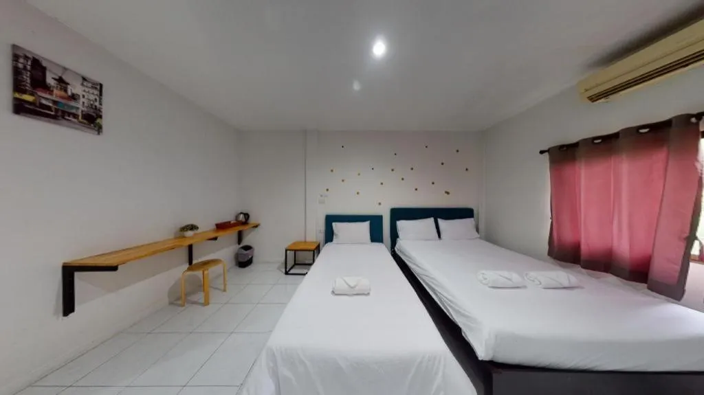 Bed in Maalamaii Hotel