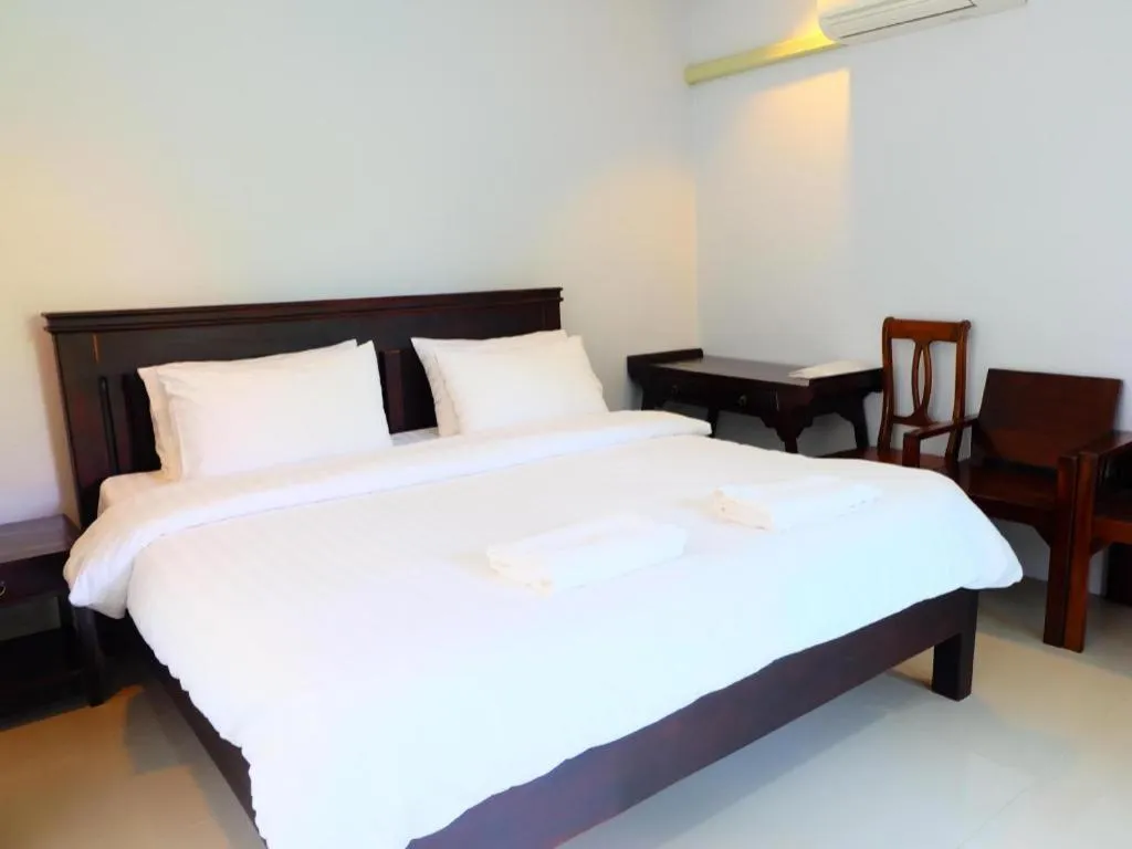 Bed in Rommai Rimnaam Resort