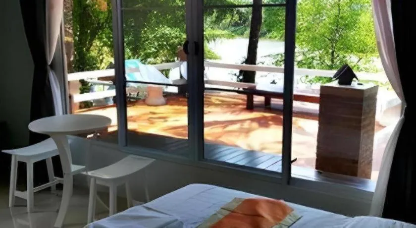 Bed in Rommai Rimnaam Resort