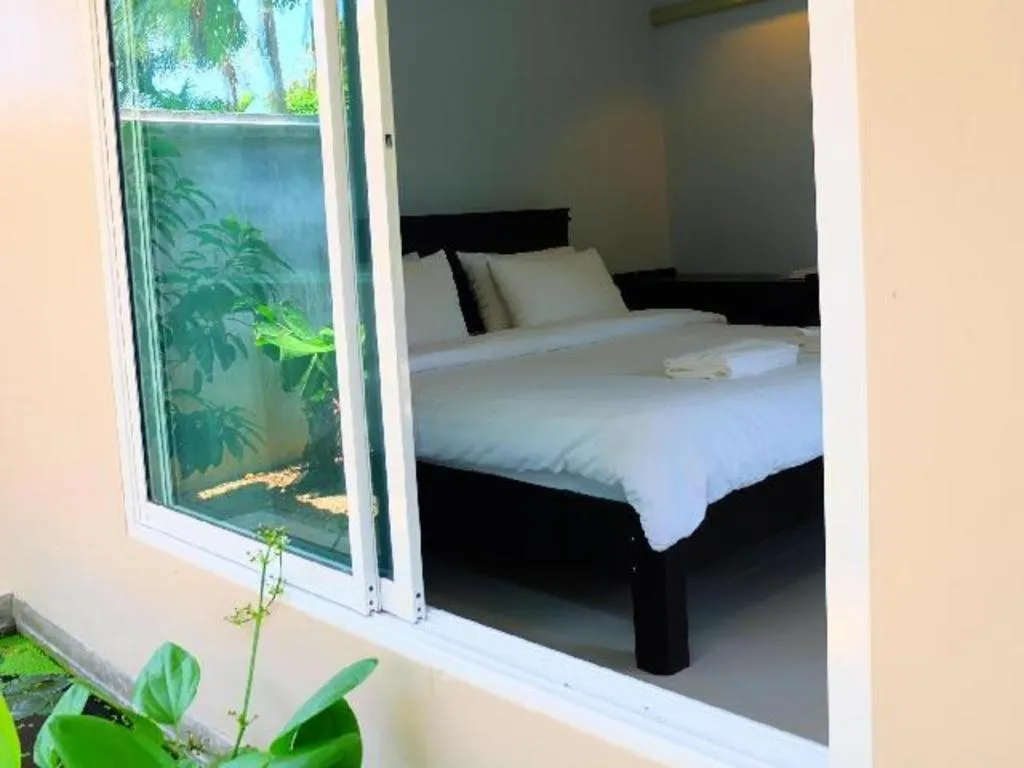 Bed in Rommai Rimnaam Resort