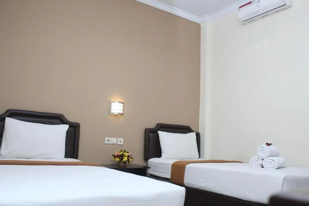 Bed in Malioboro Garden Hotel Yogyakarta