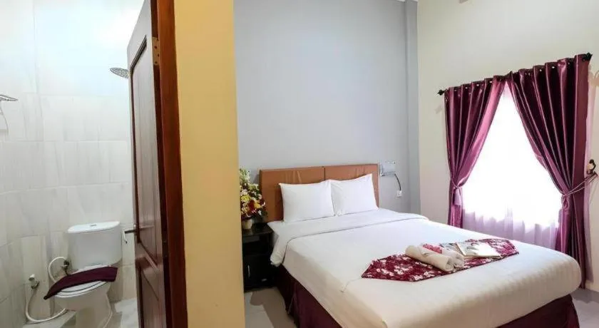 Bed in Malioboro Garden Hotel Yogyakarta