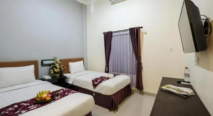 Bed in Malioboro Garden Hotel Yogyakarta