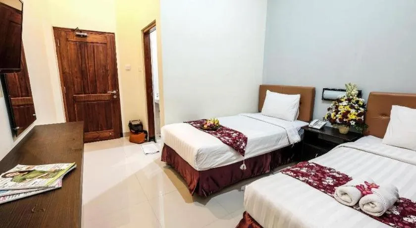 Bed in Malioboro Garden Hotel Yogyakarta