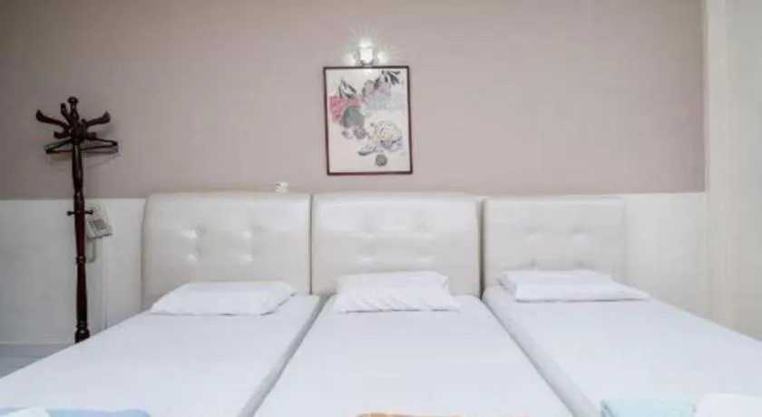 Bed in Lai Ming Hotel Cosmoland