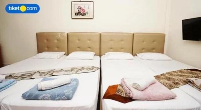 Bed in Lai Ming Hotel Cosmoland