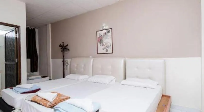 Bed in Lai Ming Hotel Cosmoland