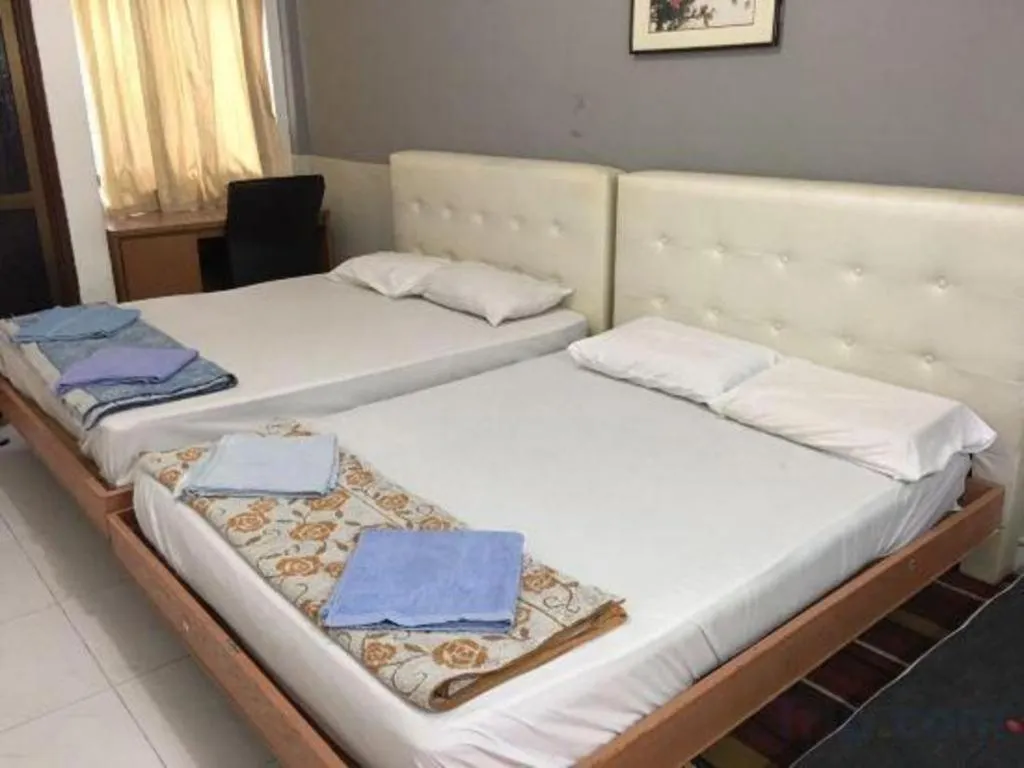 Bed in Lai Ming Hotel Cosmoland