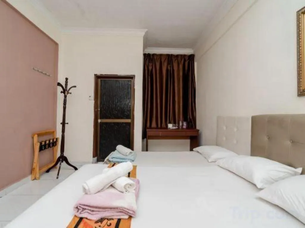 Bed in Lai Ming Hotel Cosmoland