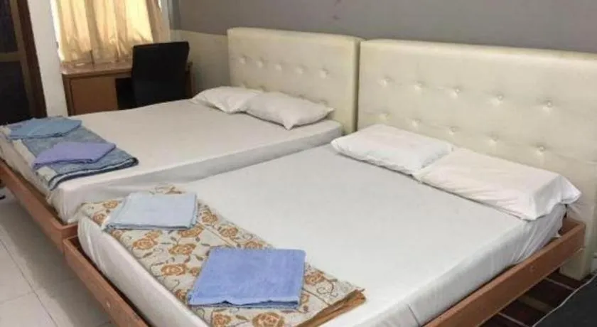 Bed in Lai Ming Hotel Cosmoland