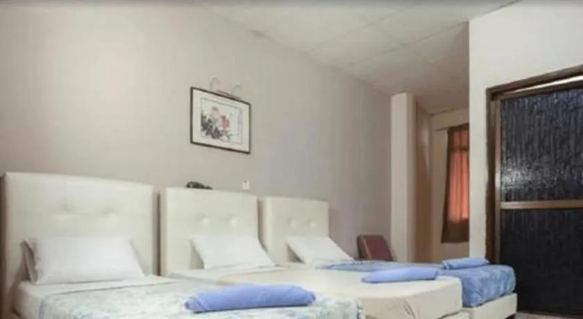 Bed in Lai Ming Hotel Cosmoland