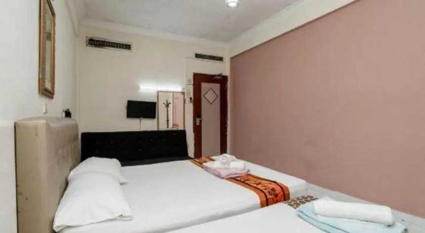 Bed in Lai Ming Hotel Cosmoland