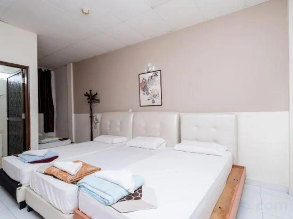 Bed in Lai Ming Hotel Cosmoland